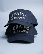 Load image into Gallery viewer, Brains &amp; Brawn Curved Brim Snapback (Navy &amp; Champagne)
