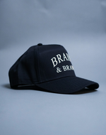 Load image into Gallery viewer, Brains &amp; Brawn Curved Brim Snapback (Navy &amp; Champagne)
